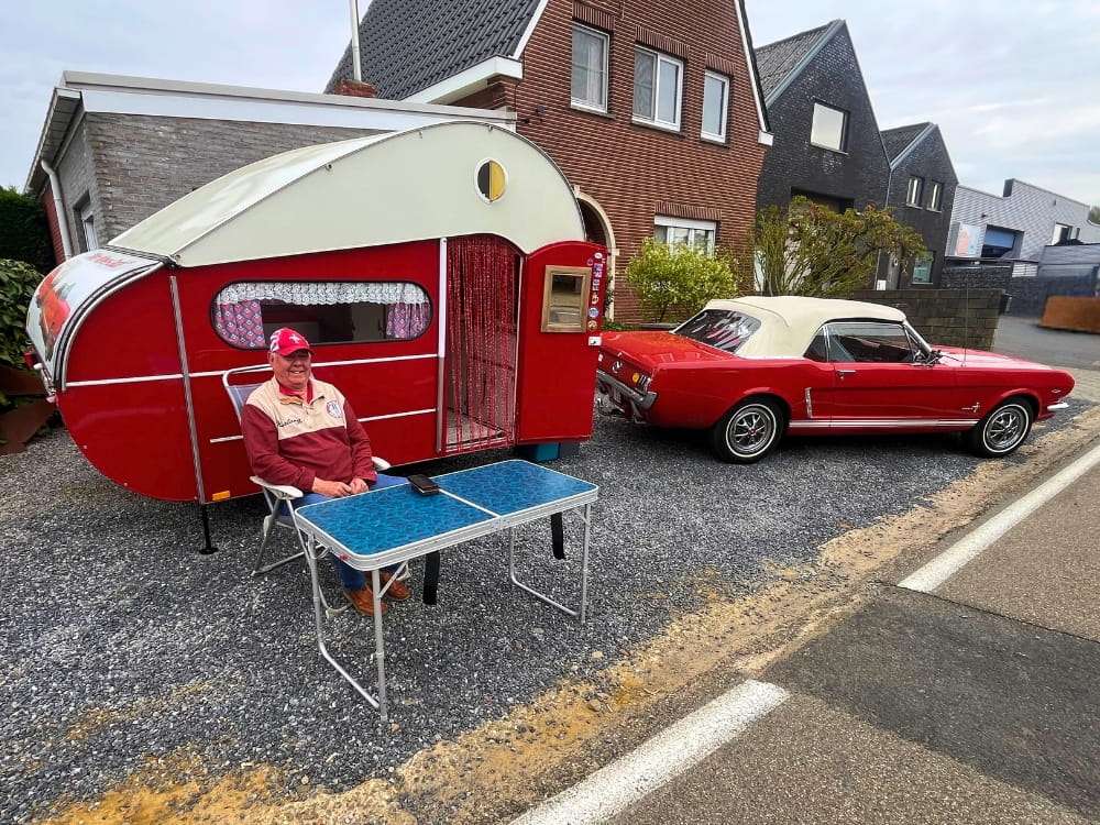 Bright red Mustang with camper